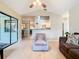 Living room with hardwood floors, access to screened patio, and open floor plan at 2226 Baker Ave, Orlando, FL 32833