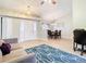 Living room with hardwood floors, a couch, and views into the dining area at 2226 Baker Ave, Orlando, FL 32833