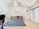 Living room with hardwood floors, a couch, and access to the backyard at 2226 Baker Ave, Orlando, FL 32833