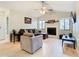 Living room with L-shaped sofa, fireplace and hardwood floors at 2226 Baker Ave, Orlando, FL 32833
