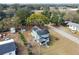 Aerial view of a two-story home with a screened porch, garden, and a detached shed at 5431 9Th Se St, Lakeland, FL 33812