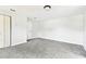Bright, spacious bedroom with fresh gray carpet and neutral paint, featuring two closets at 5431 9Th Se St, Lakeland, FL 33812