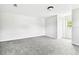 Spacious bedroom with new gray carpet, neutral walls, a closet, and a bright window at 5431 9Th Se St, Lakeland, FL 33812