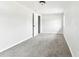 Bright bedroom with grey carpet and an open door at 5431 9Th Se St, Lakeland, FL 33812