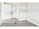 Clean bedroom features soft carpeting, neutral paint, and white trim at 5431 9Th Se St, Lakeland, FL 33812