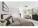 Bright bedroom with neutral tones, stylish decor, and ample natural light at 5431 9Th Se St, Lakeland, FL 33812