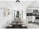 Modern dining room with a long table and kitchen views at 5431 9Th Se St, Lakeland, FL 33812