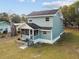 Charming two-story home with a screened front porch and tidy landscaping at 5431 9Th Se St, Lakeland, FL 33812