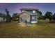 Cozy two-story home featuring a charming screened porch and a well kept lawn at 5431 9Th Se St, Lakeland, FL 33812