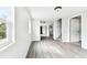 Bright and airy living area boasts modern gray floors, and neutral walls at 5431 9Th Se St, Lakeland, FL 33812
