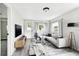 Modern living room with light gray sofa and wood-look floors at 5431 9Th Se St, Lakeland, FL 33812