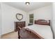 Elegant bedroom with a wooden bed frame and dresser at 1782 Sereno Dr, Davenport, FL 33896