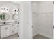 Modern bathroom with double vanity and walk-in closet at 1305 Congo Ct, Poinciana, FL 34759