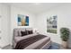 Bedroom with gray upholstered bed and brown bedding at 1305 Congo Ct, Poinciana, FL 34759