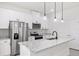 Modern kitchen with white cabinets and granite countertops at 1305 Congo Ct, Poinciana, FL 34759