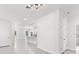 Open concept kitchen with white cabinets and island at 1305 Congo Ct, Poinciana, FL 34759