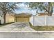 Attached garage with driveway and fence at 13212 Phoenix Dr, Orlando, FL 32828