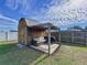 Relaxing backyard patio area with shed and pergola at 1621 Saddlehorn Dr, Lakeland, FL 33810