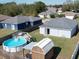 Backyard with a pool, shed, and wooden deck at 1621 Saddlehorn Dr, Lakeland, FL 33810