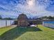 Wooden shed with pergola and partially visible pool at 1621 Saddlehorn Dr, Lakeland, FL 33810