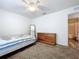Small bedroom with a twin bed and dresser at 1621 Saddlehorn Dr, Lakeland, FL 33810