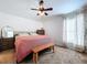Well-lit bedroom with a cozy bed, dresser, and large window at 1621 Saddlehorn Dr, Lakeland, FL 33810