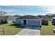 Single story home with attached garage and front yard at 1621 Saddlehorn Dr, Lakeland, FL 33810
