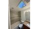 Bathroom with shower/tub, toilet and skylight at 3709 Blarney Dr, Orlando, FL 32808