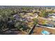 Aerial view showing a single-Gathering home with a fenced backyard and above-ground pool at 9825 Sw 46Th Ct, Ocala, FL 34476