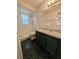 Bathroom with dark tile floor and shower at 2150 Ne 54Th St, Ocala, FL 34479