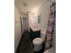 Bathroom features dark tile floors and a shower/tub combo at 2150 Ne 54Th St, Ocala, FL 34479