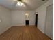 Bedroom with wood flooring and ensuite bathroom access at 2150 Ne 54Th St, Ocala, FL 34479