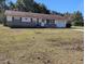 Ranch style home with a spacious lawn at 2150 Ne 54Th St, Ocala, FL 34479