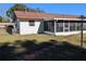 Side view of house with screened porch and walkway at 2150 Ne 54Th St, Ocala, FL 34479