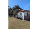 Side view of a single story home with red trim at 2150 Ne 54Th St, Ocala, FL 34479