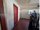 Garage or storage area with red door and exercise equipment at 2150 Ne 54Th St, Ocala, FL 34479