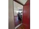 View into garage from interior door; has red door at 2150 Ne 54Th St, Ocala, FL 34479