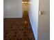A long hallway with wood-look tile flooring at 2150 Ne 54Th St, Ocala, FL 34479
