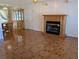 Living room featuring a fireplace and tiled floor, adjacent to dining area at 2150 Ne 54Th St, Ocala, FL 34479