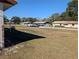 View of a quiet residential street with houses at 2150 Ne 54Th St, Ocala, FL 34479