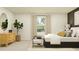 Serene bedroom with dresser, large bed, and plenty of natural light at 776 Osprey Roost Dr, Lakeland, FL 33801