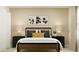Bedroom featuring a bed with black frame, nightstands and decor at 776 Osprey Roost Dr, Lakeland, FL 33801