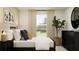 Bedroom with a bed, dresser, window, and neutral decor at 776 Osprey Roost Dr, Lakeland, FL 33801