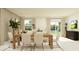 Open concept dining room with sliding doors to the backyard at 776 Osprey Roost Dr, Lakeland, FL 33801