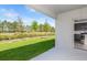 Backyard featuring a grassy area with an open view to the treeline at 9076 Wildlight Trl, Wildwood, FL 34785