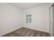 Bedroom featuring carpet, window, and a closet with sliding doors at 9076 Wildlight Trl, Wildwood, FL 34785