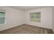 Bright bedroom with carpet and large windows offering plenty of natural light at 9076 Wildlight Trl, Wildwood, FL 34785