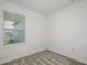 Cozy bedroom with carpet and window offering a view of the neighborhood at 9076 Wildlight Trl, Wildwood, FL 34785
