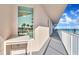 Oceanfront balcony with white railings and outdoor seating at 3737 S Atlantic Ave # 204, Daytona Beach Shores, FL 32118