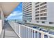 Balcony overlooking ocean, parking lot and neighboring building at 3737 S Atlantic Ave # 204, Daytona Beach Shores, FL 32118